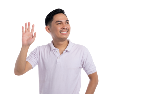 Smiling young Asian man in white polo shirt waving hand and looking aside isolated on transparent background