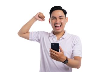Happy Asian man celebrating success while looking at smartphone with raised fist isolated isolated on transparent background