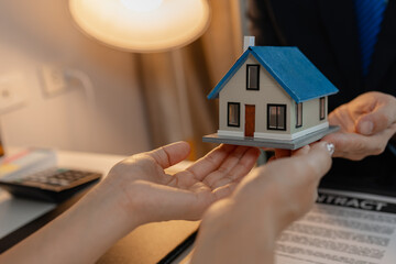 staff is explaining the information about the house lease contract documents to the buyer, the...