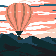 Hot air balloon floating over the mountain landscape view