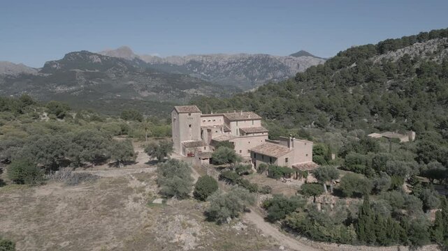 Stunning 4K drone footage over Muleta Gran Hotel in Mallorca, revealing a peaceful hilltop retreat surrounded by mountains, olive groves, and sea views&mdash;ideal for luxury, travel, and nature visuals.