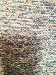 Close-Up Photograph of Vibrant Textured Fabric with Detailed Weave Pattern
