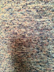 Close-Up Photograph of Vibrant Textured Fabric with Detailed Weave Pattern
