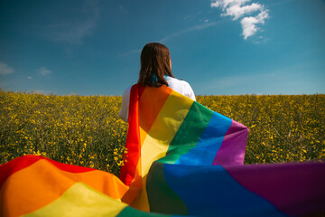 Young woman with LGBT flag.