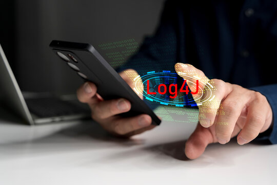 Cybersecurity threat from Log4J vulnerability on mobile device with binary code and warning interface