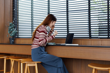 Successful caucasian happy young woman student freelancer using laptop, watching webinars, working...