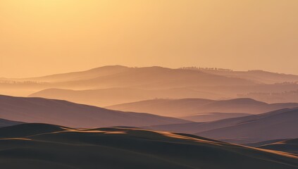 Misty mountain range at sunrise