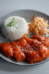Chicken Katsu with Mentai, Indonesia, captured on June 16, 2025. Crispy breaded chicken cutlet topped with creamy mentaiko sauce, combining Japanese and local flavors in a savory fusion dish.