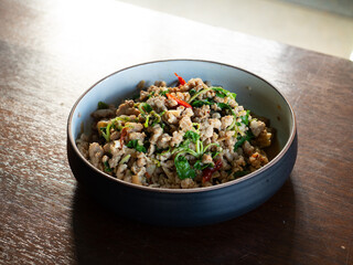 Dish of Pad Kaprao, Thai spicy stir fried minced pork with holy basil leaves