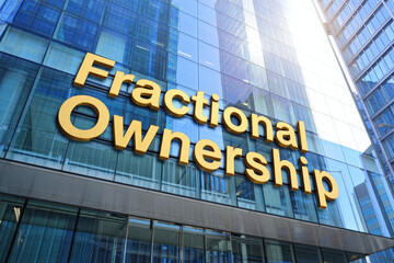 Obraz premium Gold 3D letters fractional ownership sign modern office building business investment concept, Selective Focus..