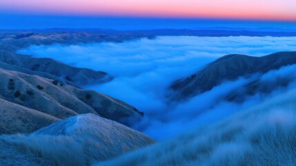 Misty mountain valley at dawn