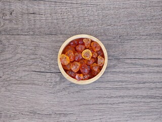 Peach gum in wooden bowl.