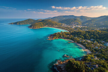 A stunning aerial view of Phuket, Thailand,  tropical beaches and lush green mountains. This high-resolution image showcases the natural beauty of Phuket’s coastline, with clear blue skies