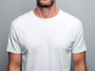 Fototapeta premium white t-shirt worn by a man, close-up centered chest view, high-quality cloth detail, clean lighting, no face, plain backdrop