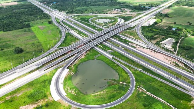 Aerial view drone footage of a complex bridge intersection where multiple highway numbers 290 and 304 Nakhon Ratchasima