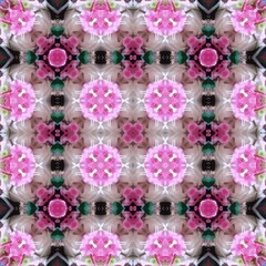 Seamless kaleidoscope floral pattern symmetrical arrangement of pink blossoms and green accents creates a visually appealing and balanced design for fabric, wallpaper, and backgrounds