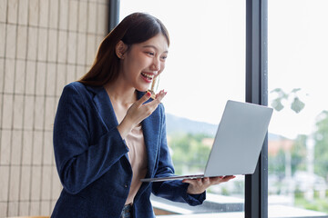 Successful Happy caucasian young woman student freelancer using laptop, watching webinars, working...