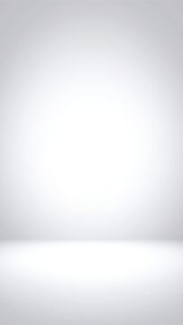 A pristine white background showcasing subtle gradients of light and shadow, creating a soft, ethereal atmosphere that enhances depth and dimension.