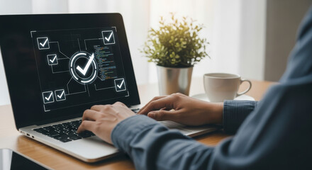 Person Using Laptop Displaying Checkmark Symbols on Wooden Desk with Coffee Cup and Small Plant in Daylight