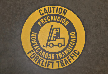 Caution Forklift Traffic sticker on warehouse floor warning safety signs.
