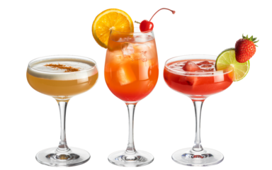 A trio of colorful cocktails in different glasses is displayed, featuring garnishes like a lime slice, an orange slice, and a strawberry. 