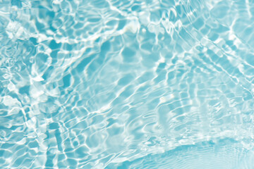 Blue water with ripples on the surface. Defocus blurred transparent blue colored clear calm water...