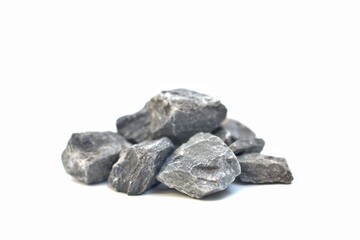 Different shapes of grey crushed rocks. Isolated on white background. Concept showing the differences of each type of rock for its correct use.