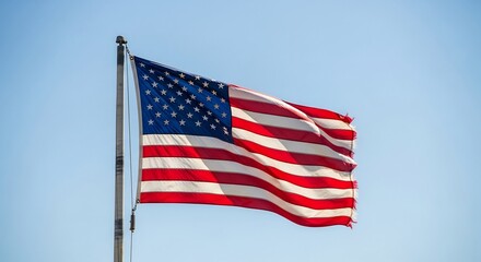 Obraz premium American Flag Waving Proudly in the Sky: A Symbol of Freedom and Patriotism