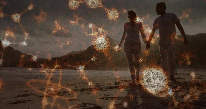 Thinning cell health overlay revealing pregnant couple walking hand in hand celebrating pregnancy