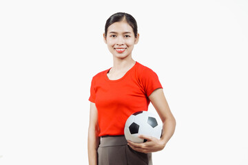 Confident young Asian woman in vibrant red shirt stands against white background, cheering joyfully...