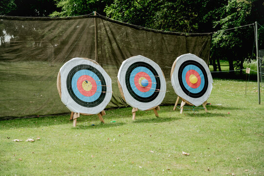 Archery targets with arrows outdoor scene