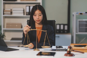 Judge gavel with Justice lawyers having team meeting at law firm background. Concepts of Law and...