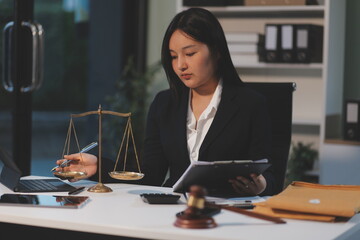 Judge gavel with Justice lawyers having team meeting at law firm background. Concepts of Law and...