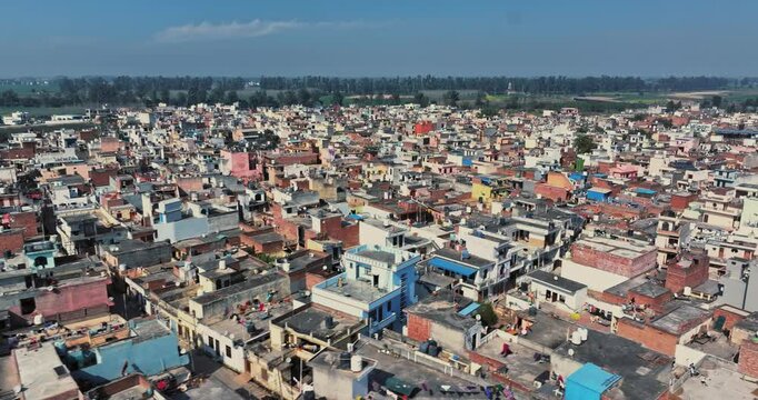 Aerial view of an Indian City and agricultural fields near the Delhi-Chandigarh Highway in Punjab, India. Natural texture for the background. The picturesque countryside of India. Healthy food concept