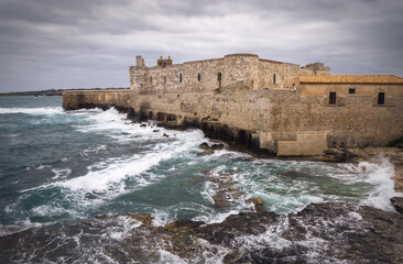 Majestic Ortigia Castle Overlooks Crashing Waves of Sicilian Coast, Italy