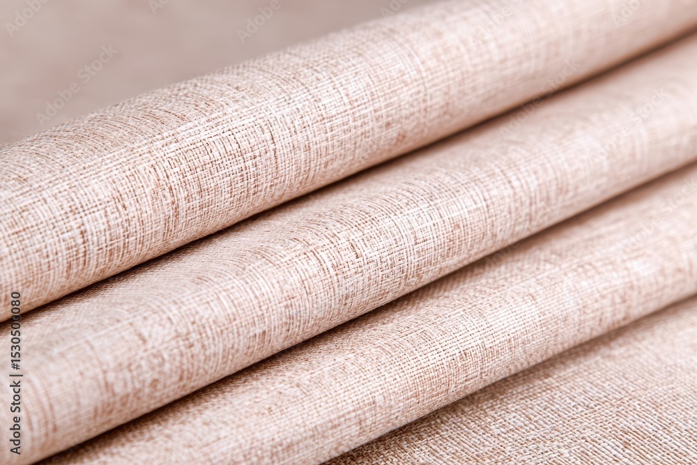 Poster A stack of tan fabric with a slightly fuzzy appearance