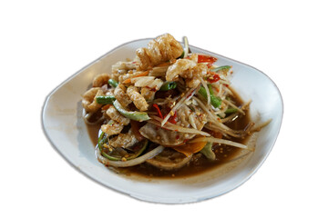 Isolated dish of Thai spicy papaya salad with raw shrimp