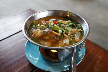 Close up hot pot of Thai Spicy pork tendon soup
