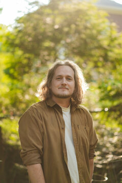Man with Long Hair standing outside