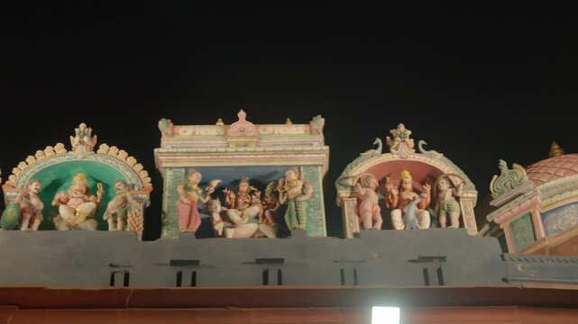 Varanasi, Uttar Pradesh, India-24th February 2025- Compact left panning high speed shot of sculptured idols on top of Gauri Kedareshwar Temple in Varanasi City in Uttar Pradesh.