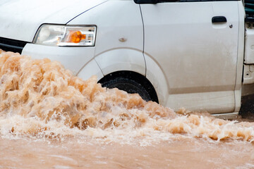 Heavy rain causes urban flooding as water covers streets, disrupting daily life and transportation.