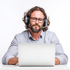 Man working from home on laptop wearing headset for online meeting or customer service call center agent
