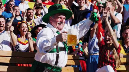 Bavarian man celebrating with beer stein at festival