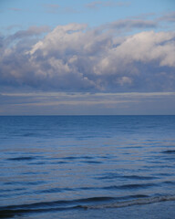 Fototapeta premium Calm Sea with Clouds on Horizon