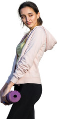 A young slim athletic girl in sportswear performs a set of exercises. Fitness and healthy lifestyle  against the background of green spring pasture hills.