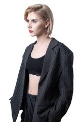 Portrait of a seductive, stylish business lady in the studio. Blonde girl in a suit and top.