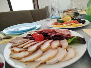 Assorted cold cuts platter on table