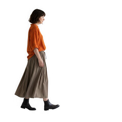 Woman walking in orange shirt and brown skirt isolated on transparent background