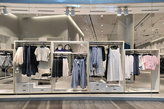 Penang, Malaysia &ndash; May 25, 2025: A clean and modern view of the H&M fashion store showcasing an organized display of women's clothing, including tops, dresses, jeans, and accessories.