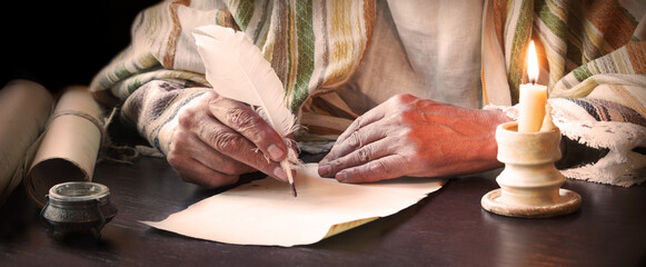 Male hand witn big quill